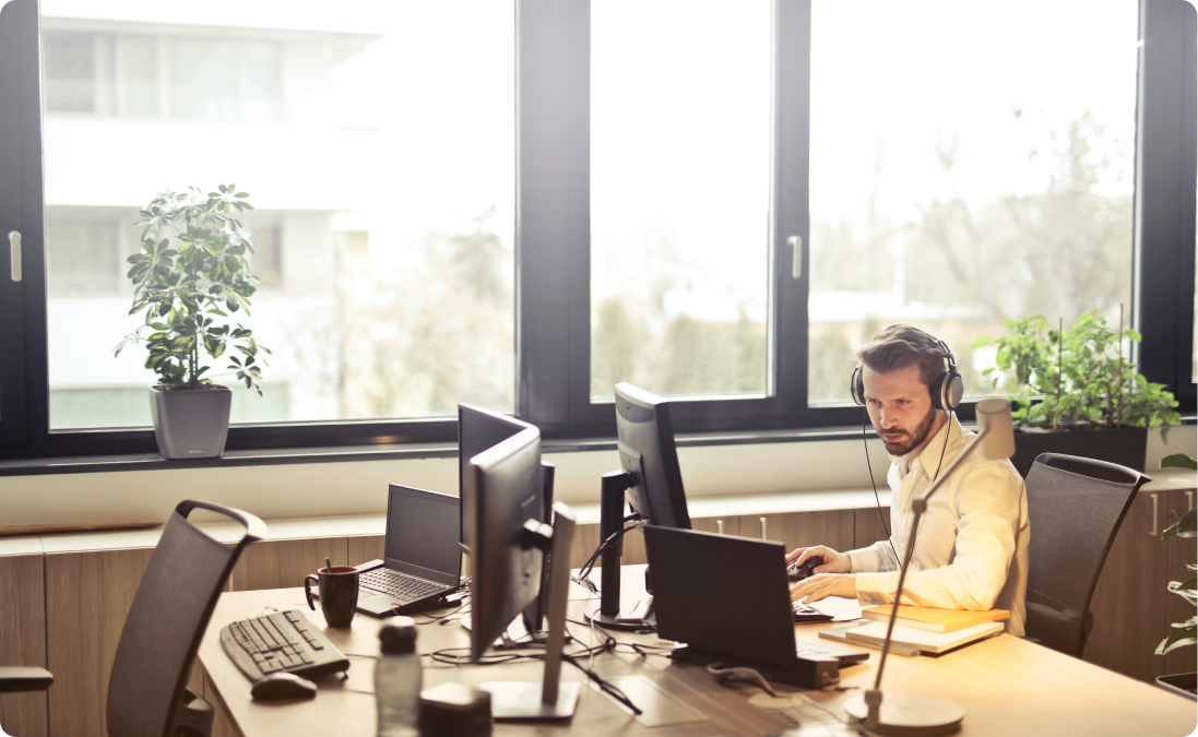 A person translating legal documents from  Portuguese speaking countries on a computer at a desk.